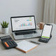 Minimal desk with laptop finance dashboard and budgeting tools for managing online business cash flow