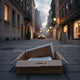 Partially opened mystery package with pages and a brass key on a city sidewalk at dusk